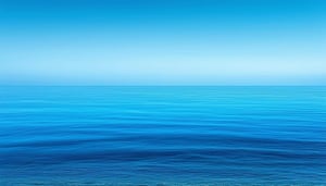 A calm ocean scene, in shades of blue